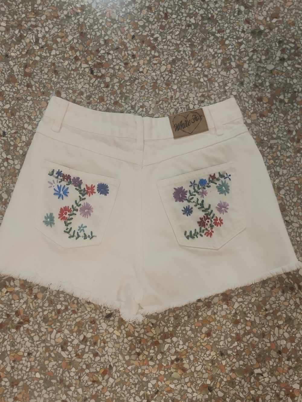 White Fox Boutique White Denim Shorts with Multicolor Floral Pocket Embroidery